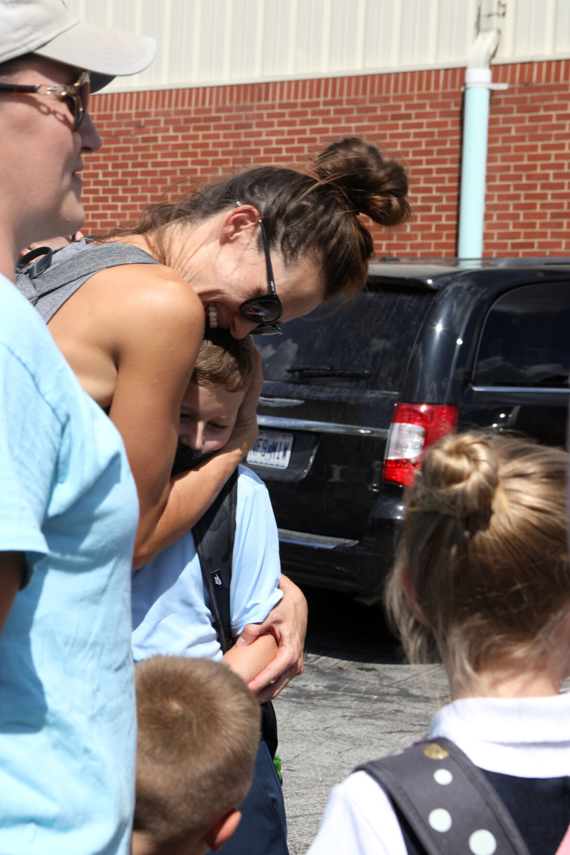 Hannah Servais hugs Quinn Servais